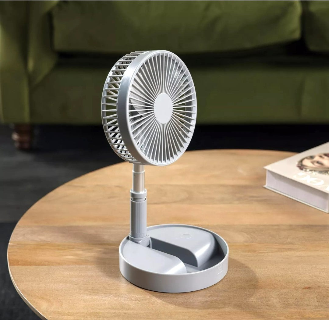 B&H Telescopic Folding Fan. Grey. Beat the heat and enjoy portable comfort with the B&H Telescopic Folding Fan.