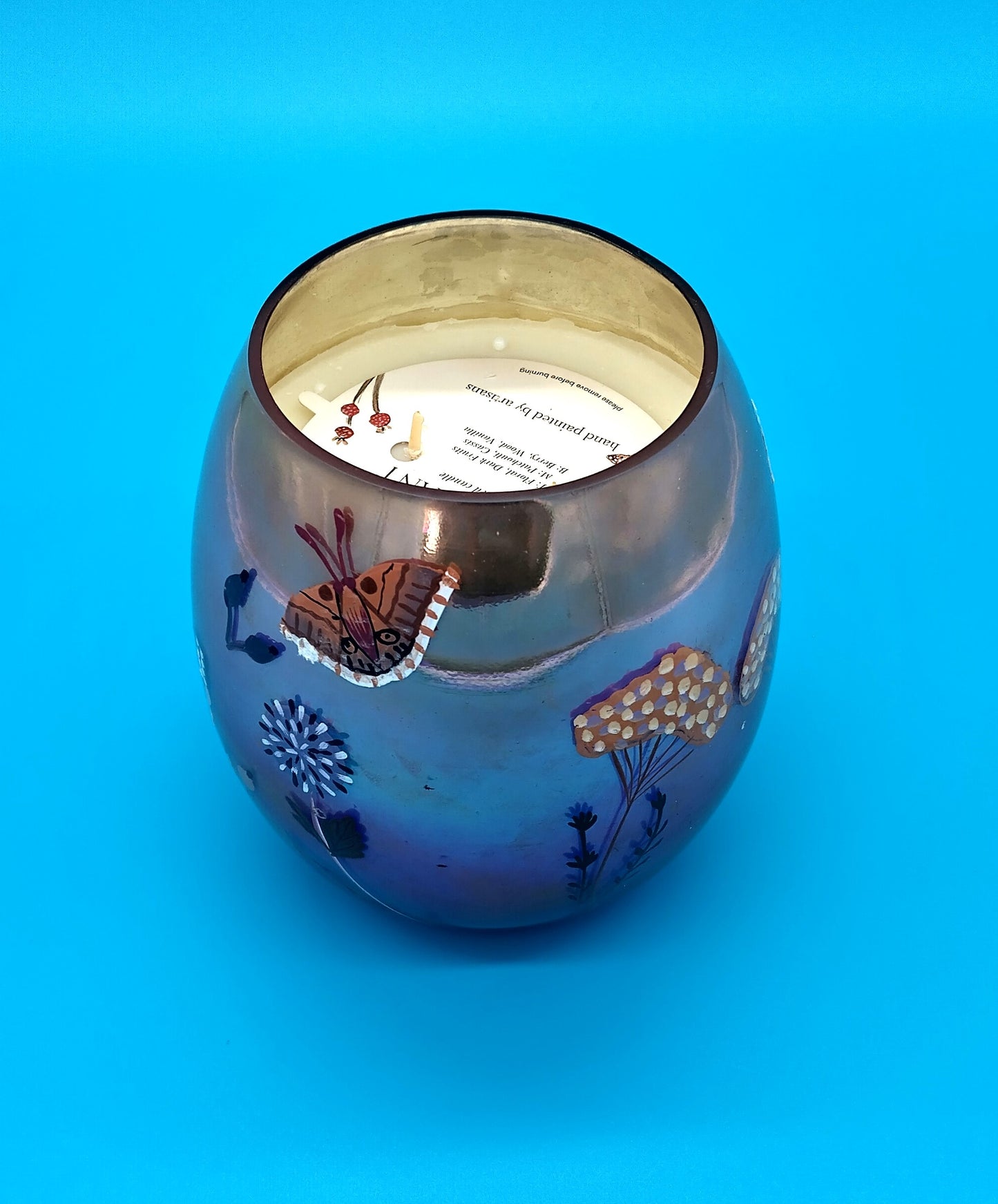 Candle Hand Painted By Artisans  Illuminate your home with elegance and artistry with our Hand Painted Decorative Candle. . Size 13cm x 16cm.