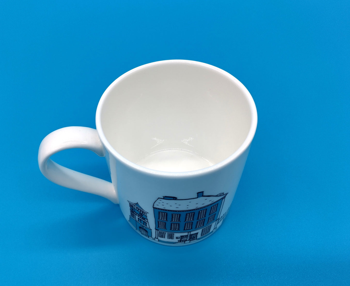 Mandy Billington Mug. White-Blue. Elevate your drinking experience with the stylish and durable Mandy Billington Mug.