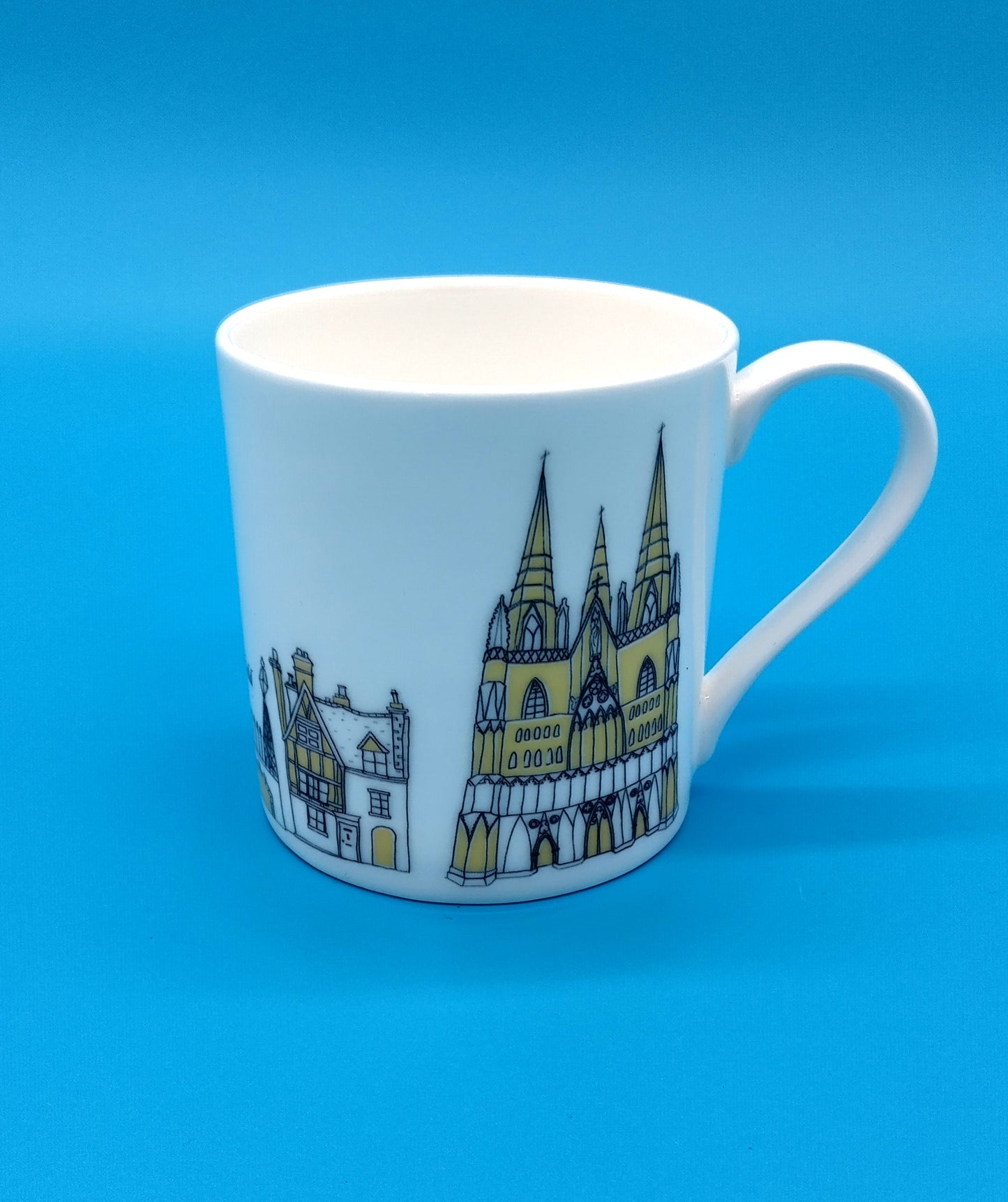 Mandy Billington Mug. White-Yellow. Add a touch of brightness to your daily routine with the stylish and durable Mandy Billington Mug.