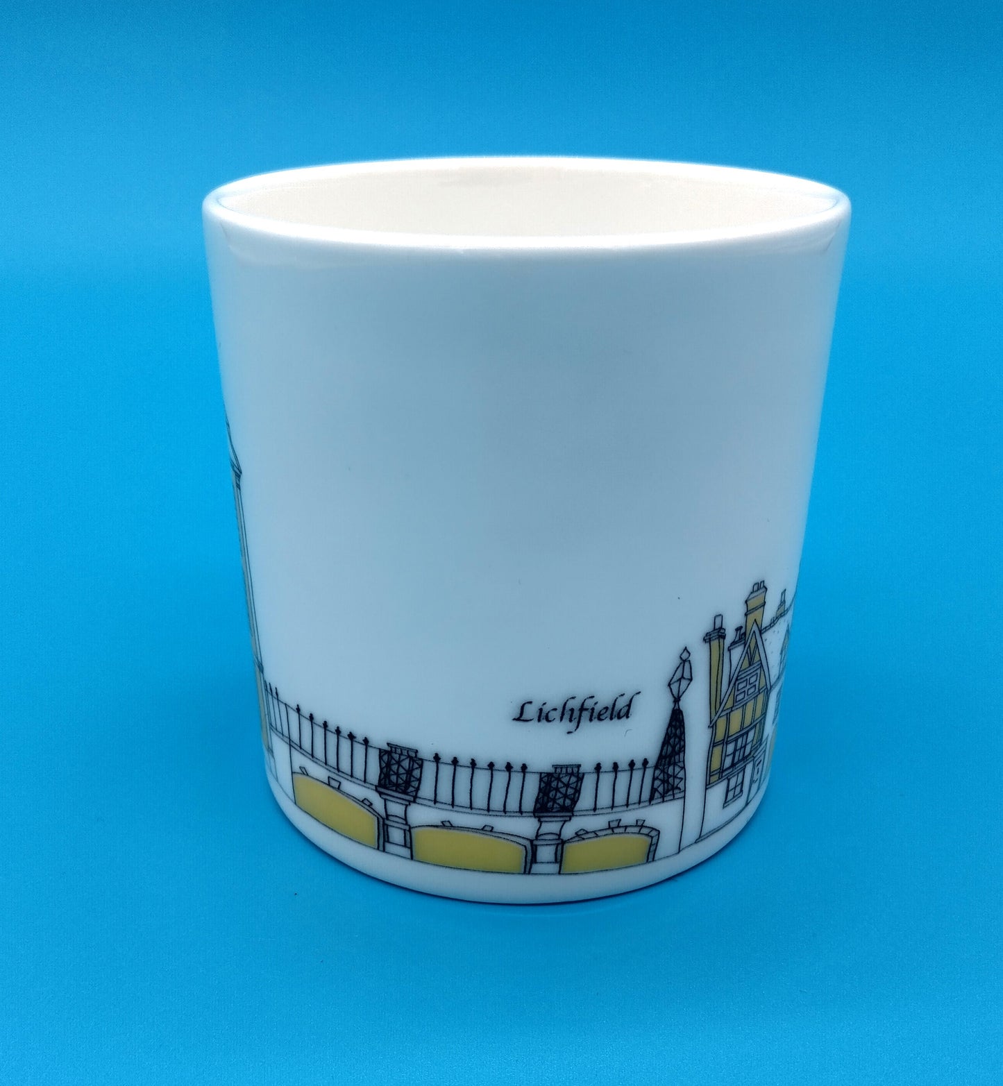 Mandy Billington Mug. White-Yellow. Add a touch of brightness to your daily routine with the stylish and durable Mandy Billington Mug.