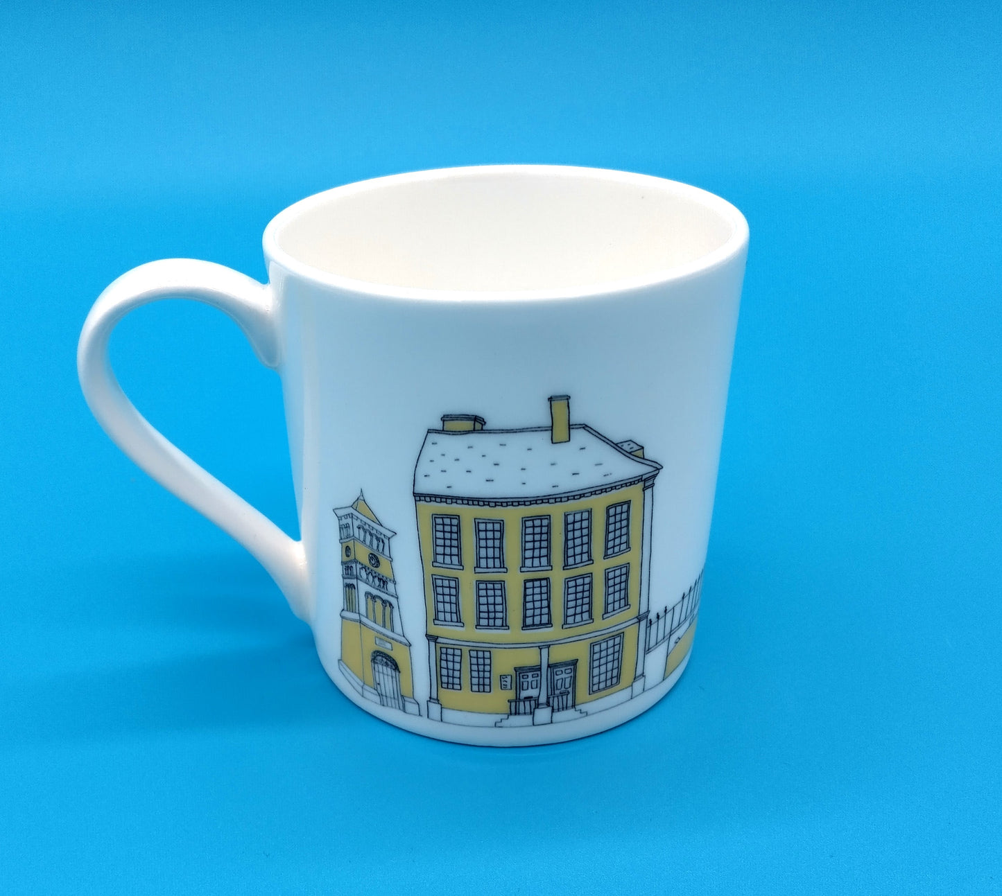 Mandy Billington Mug. White-Yellow. Add a touch of brightness to your daily routine with the stylish and durable Mandy Billington Mug.