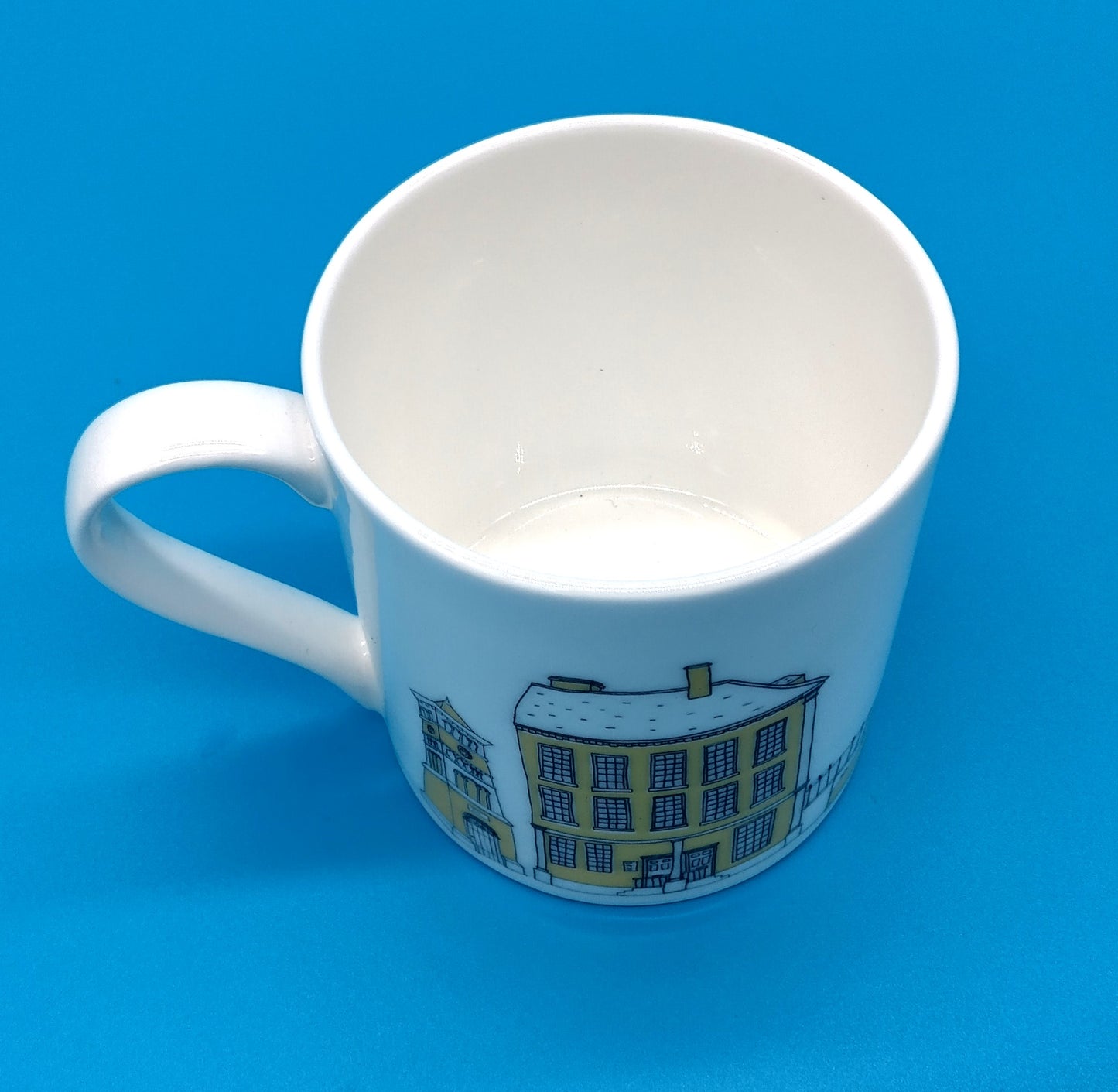 Mandy Billington Mug. White-Yellow. Add a touch of brightness to your daily routine with the stylish and durable Mandy Billington Mug.