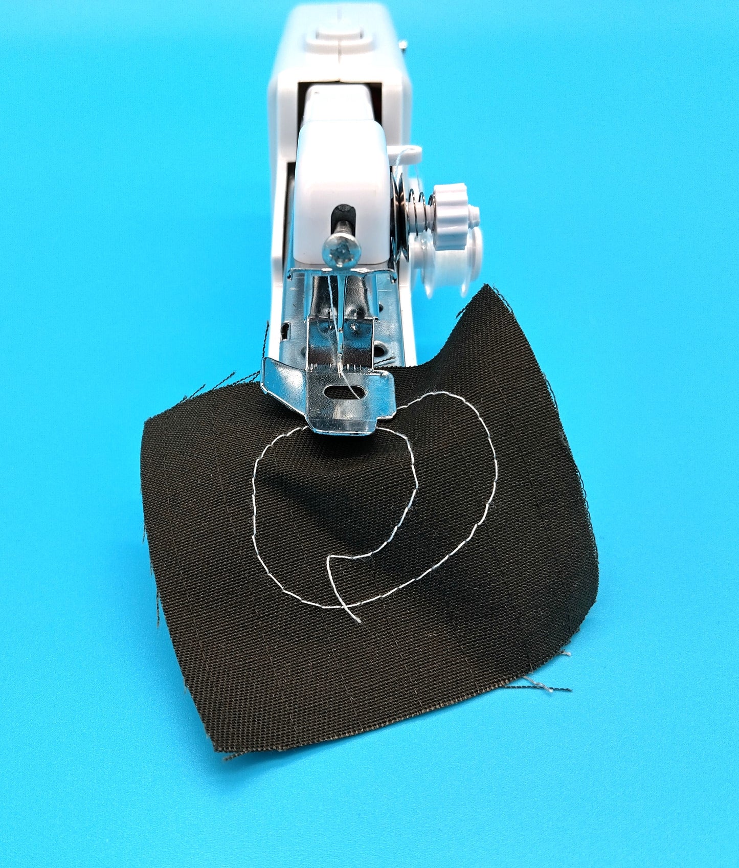 The Handheld Sewing Machine. Perfect for quick repairs, DIY projects, and on-the-go sewing needs.