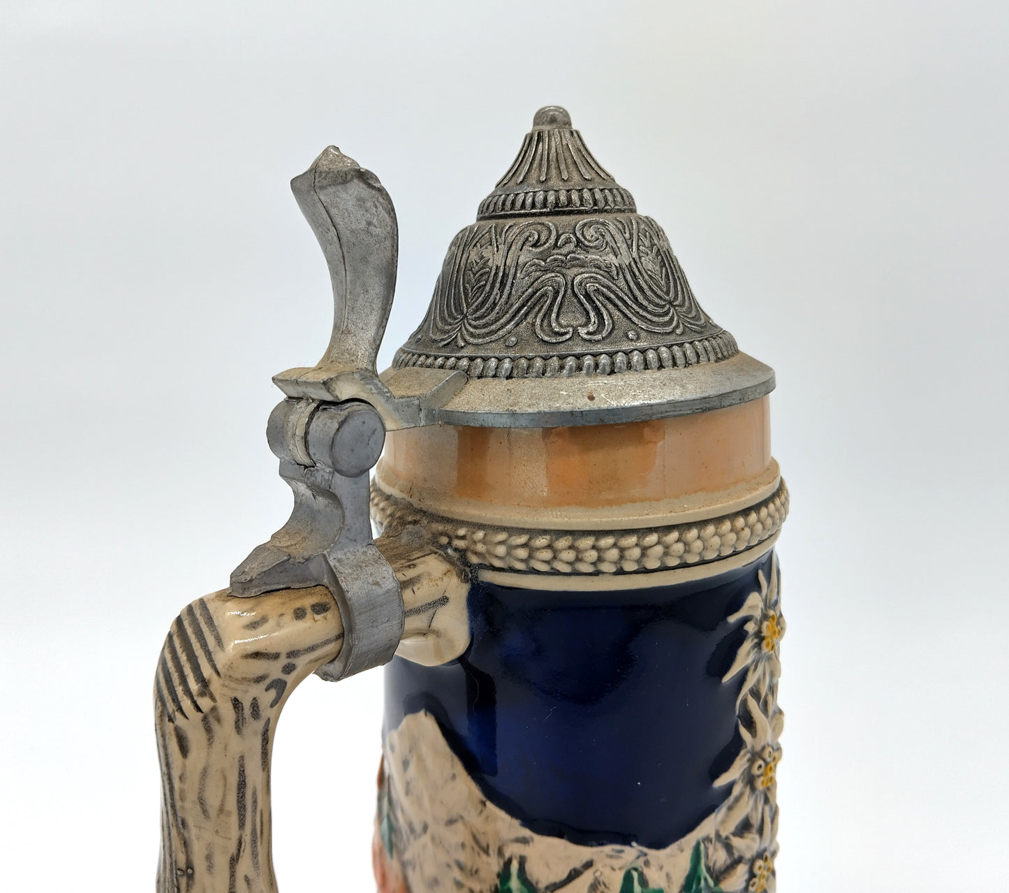 German Porcelain Pewter Beer Stein Mug with Music Box. Enhance your collection and beer-drinking experience with the German Porcelain Pewter Beer