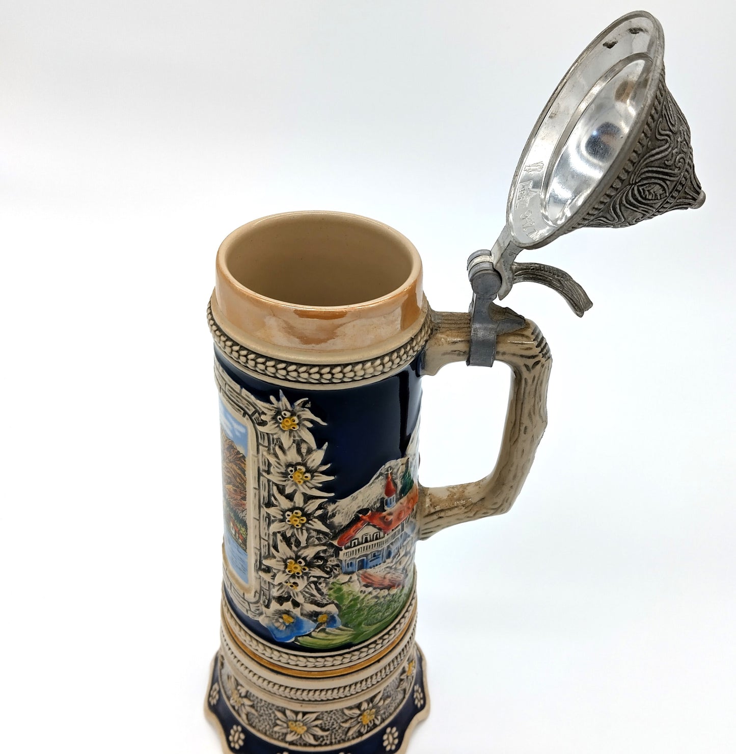 German Porcelain Pewter Beer Stein Mug with Music Box. Enhance your collection and beer-drinking experience with the German Porcelain Pewter Beer