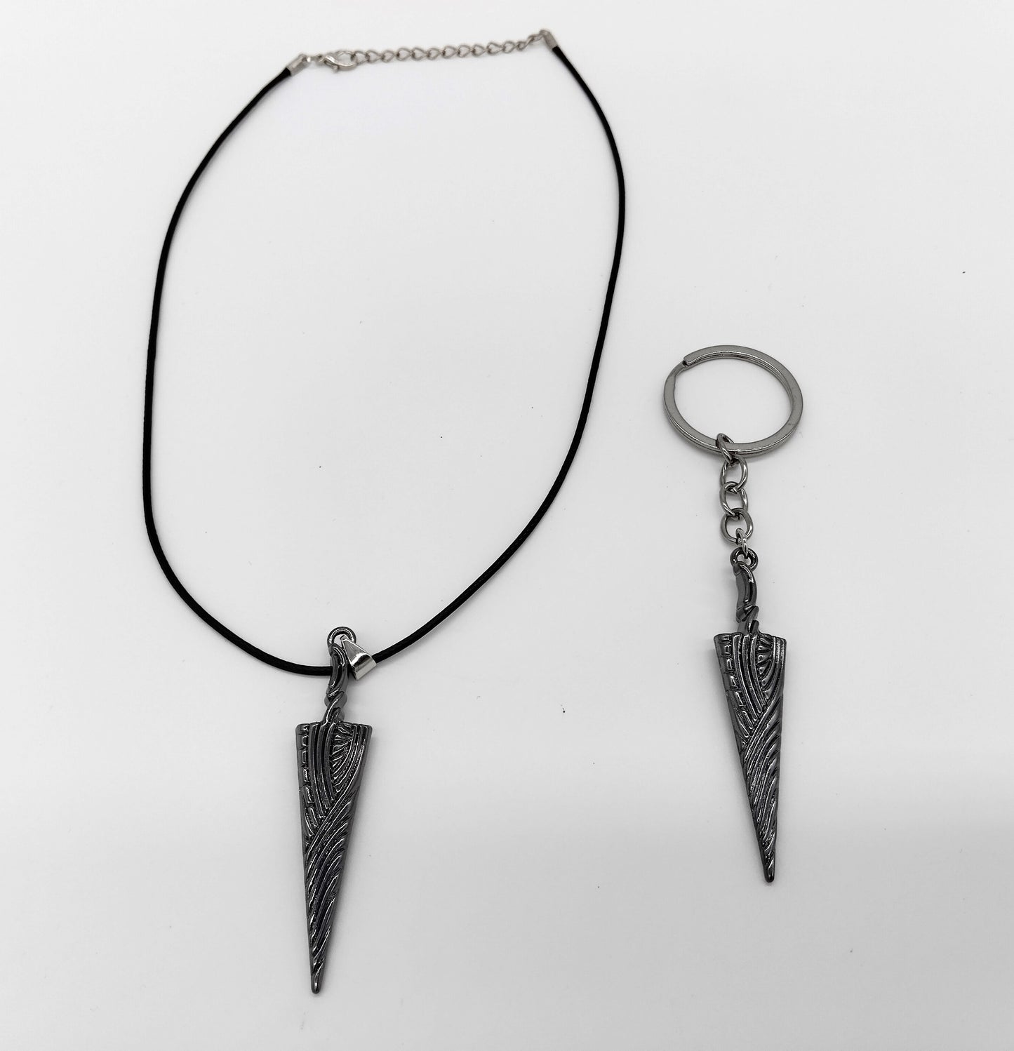 Set Necklace and Keychain.  A perfect blend of style and fandom for any Hollow Knight enthusiast.