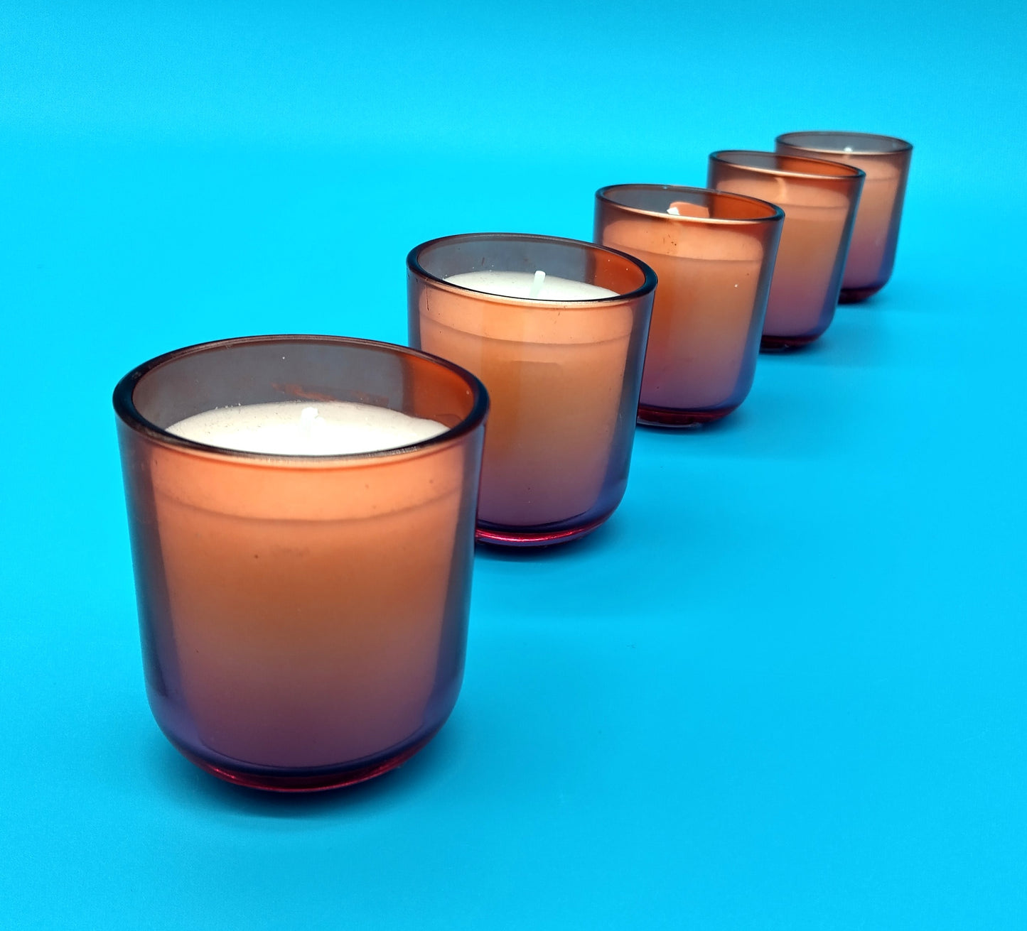 Glass Candles. 5 Pcs. Enhance your decor with the elegant glow of these Glass Candles.