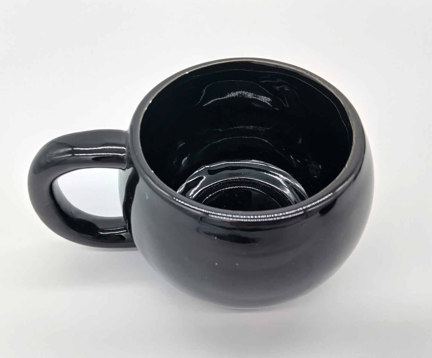 Black Mugs. 4 Pcs. Black.  Add a touch of elegance to your drinkware collection with our 4-piece porcelain mug set.