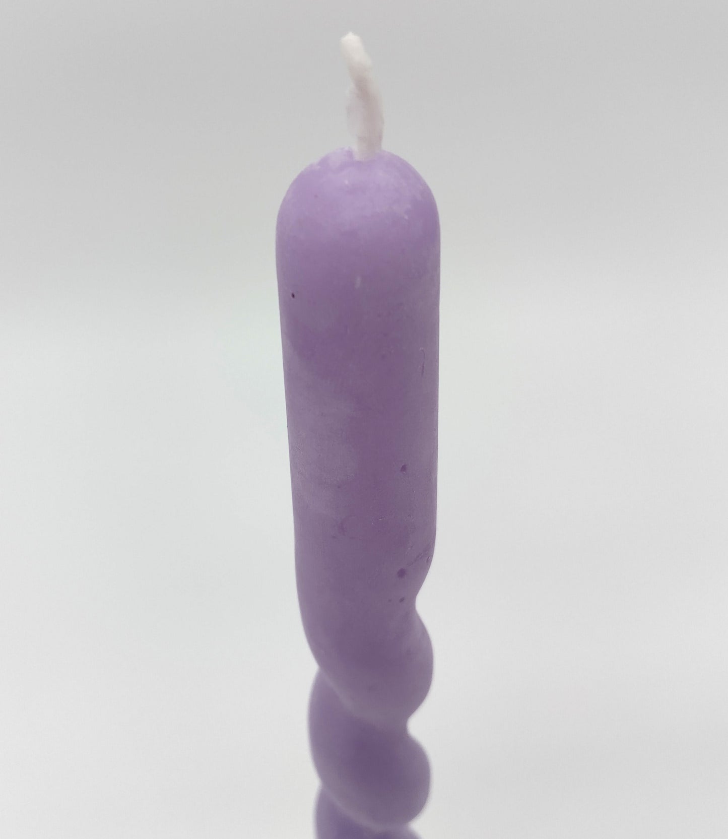 Twist Candle. Pale Lilac Twist. Height 31cm. Perfect for adding a decorative touch and creating a warm, inviting atmosphere.