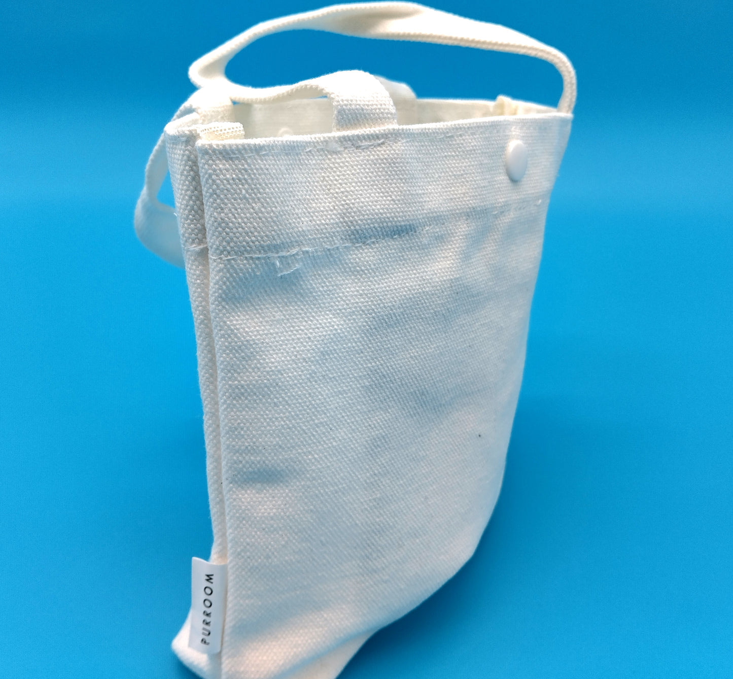 Purrom Canvas Bag. Size 17cm x 23cm. White. Upgrade your accessory game with the Purrom Canvas Bag,