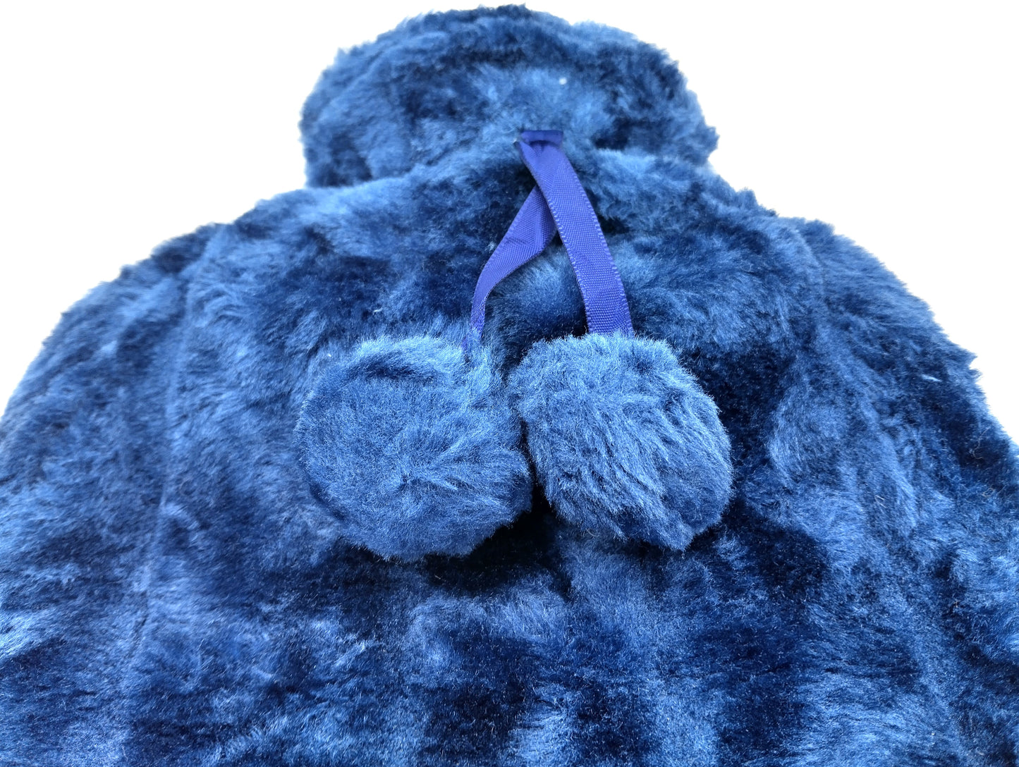 Cosy Faux Fur Hot Water Bottle. 2L.  Transform your cold nights into a warm, cosy haven with the Luxury Cosy Faux Fur Pom Pom Hot Water Bottle. W