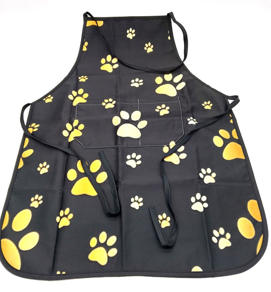 Kitchen Apron. Add a touch of style and functionality to your kitchen with the Gold Dog Paw Prints Kitchen Apron.