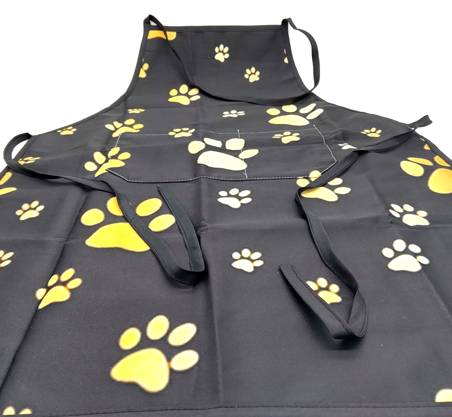 Kitchen Apron. Add a touch of style and functionality to your kitchen with the Gold Dog Paw Prints Kitchen Apron.