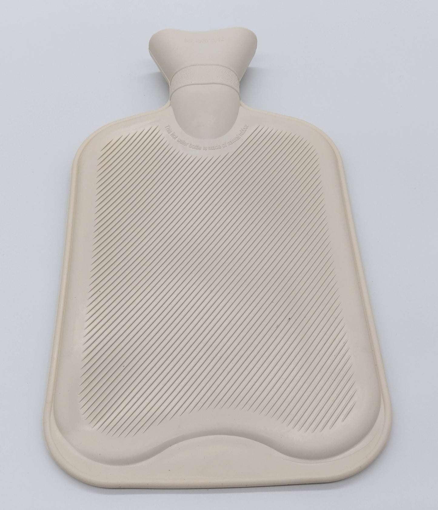 Hot Water Bottle. 2 Litre. Cream. Stay warm and cozy with a touch of elegance.