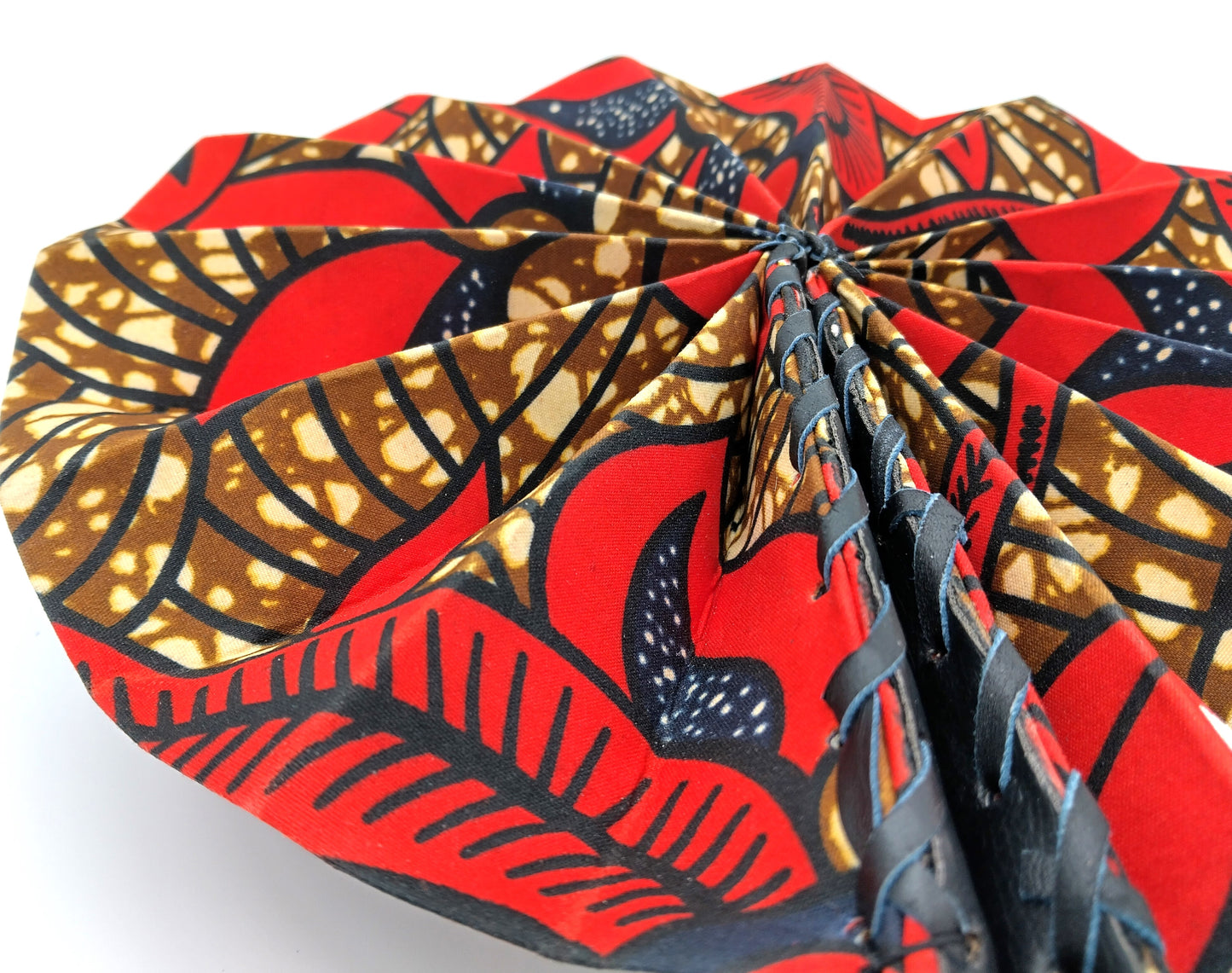 Omotola African Folding Handheld Fan. Red-Multicolor. Embrace the beauty of African design with the Omotola Folding Handheld Fan.