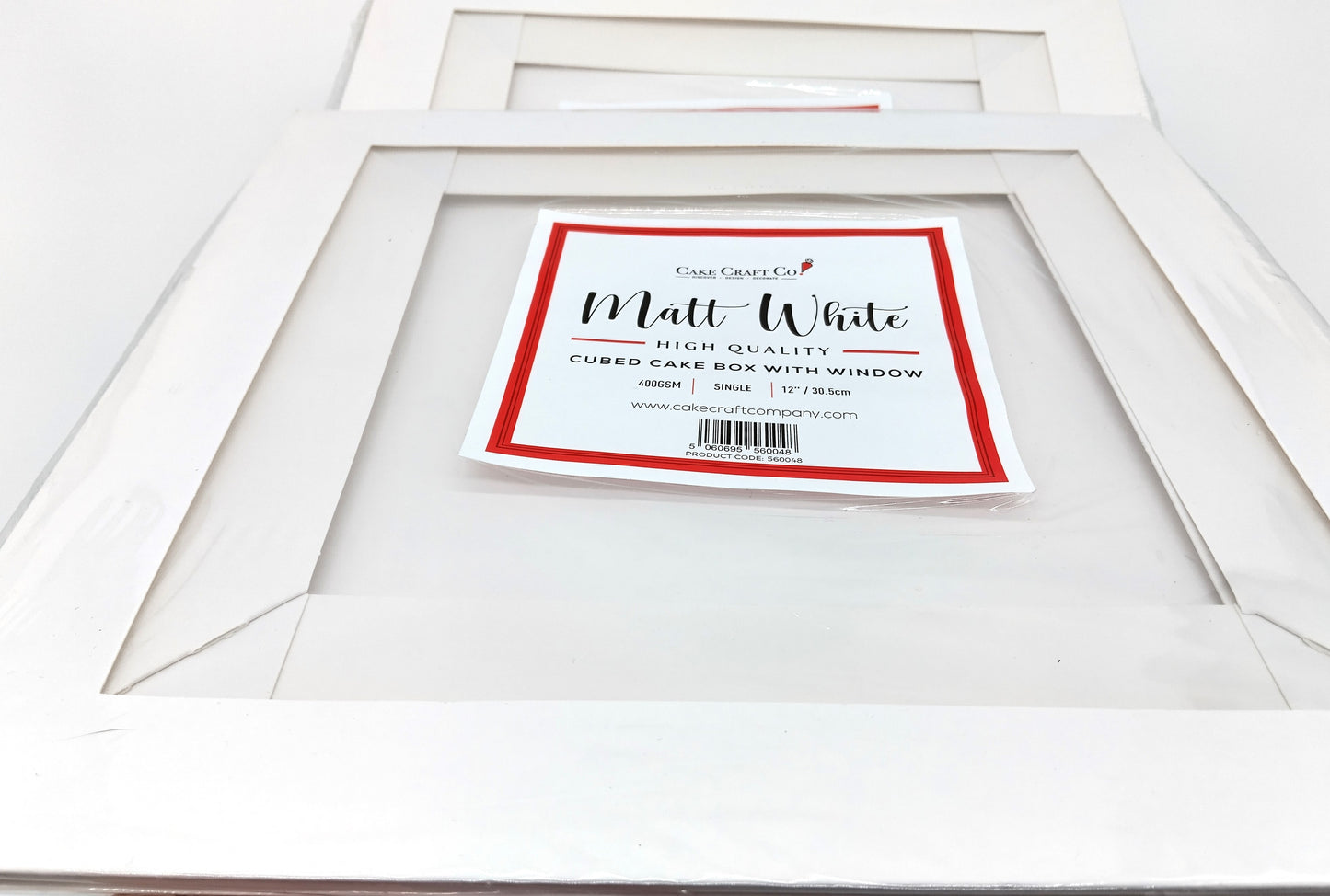 Pack of 9 Cake Craft Company 12 inch White Clear Tall Cake Box. Order today and ensure your cakes arrive safely and beautifully displayed!